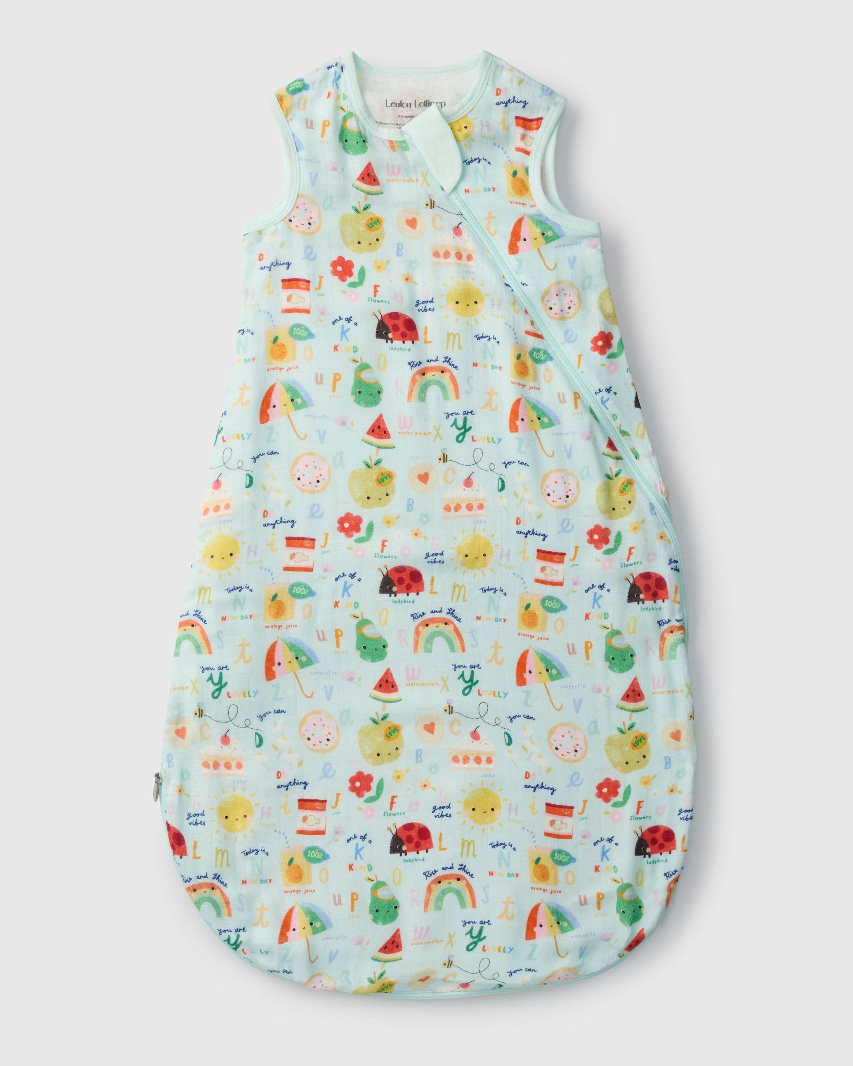 Loulou Lollipop muslin 0.5 TOG lightweight baby sleep bag in Alphabet Smiles — front view on white background