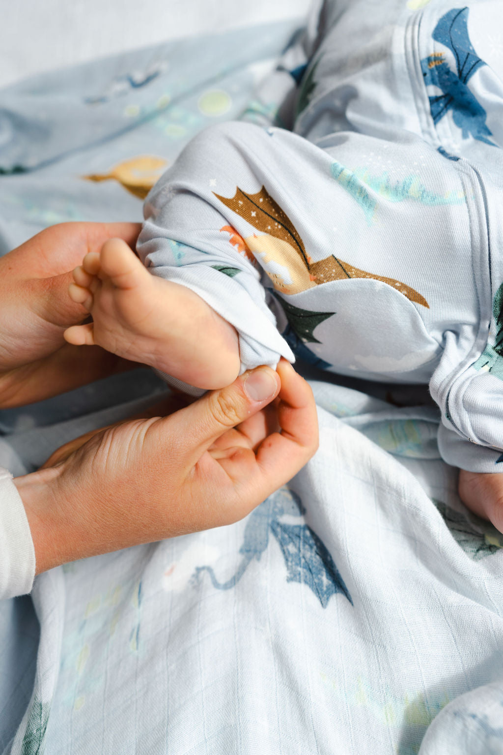 Baby Sleeper in TENCEL Lyocell showing fold over foot cuff in Magical Dragons print.