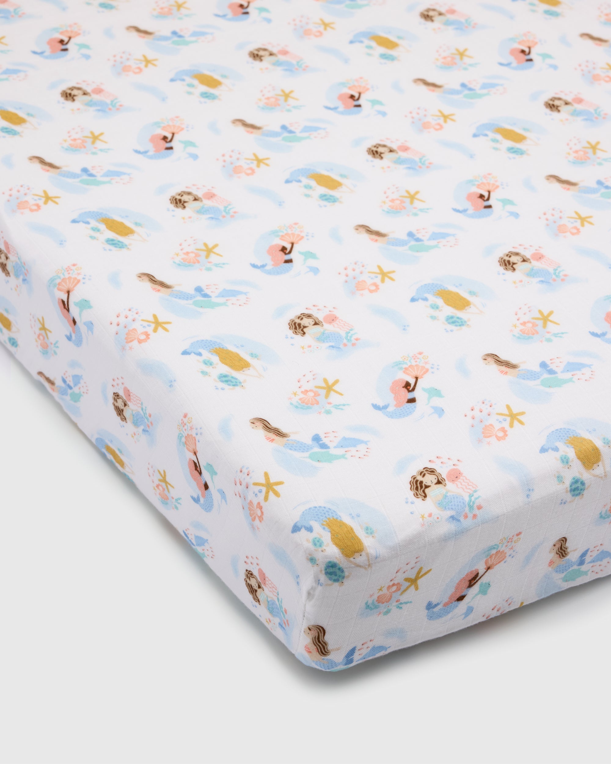 Loulou Lollipop muslin fitted crib sheet in Mermaids for US standard crib — front view on white background