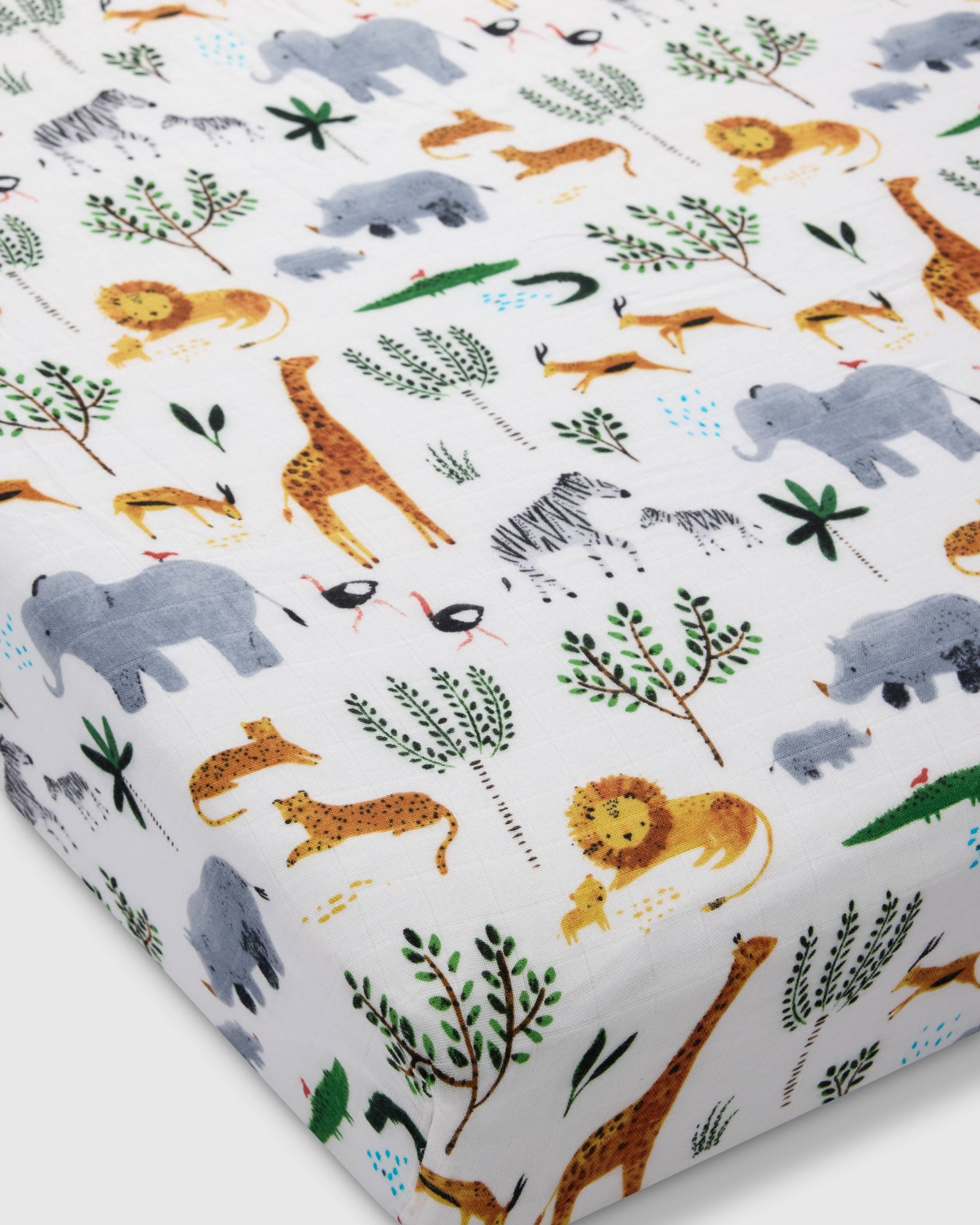 Loulou Lollipop muslin fitted crib sheet in Safari Jungle for US standard crib — front view on white background