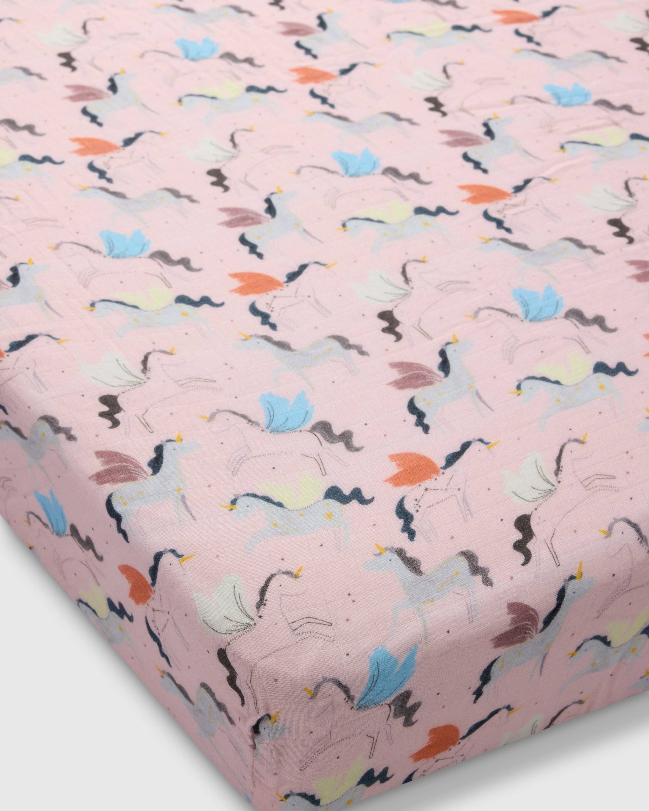 Loulou Lollipop muslin fitted crib sheet in Unicorn Ballet for US standard crib — front view on white background