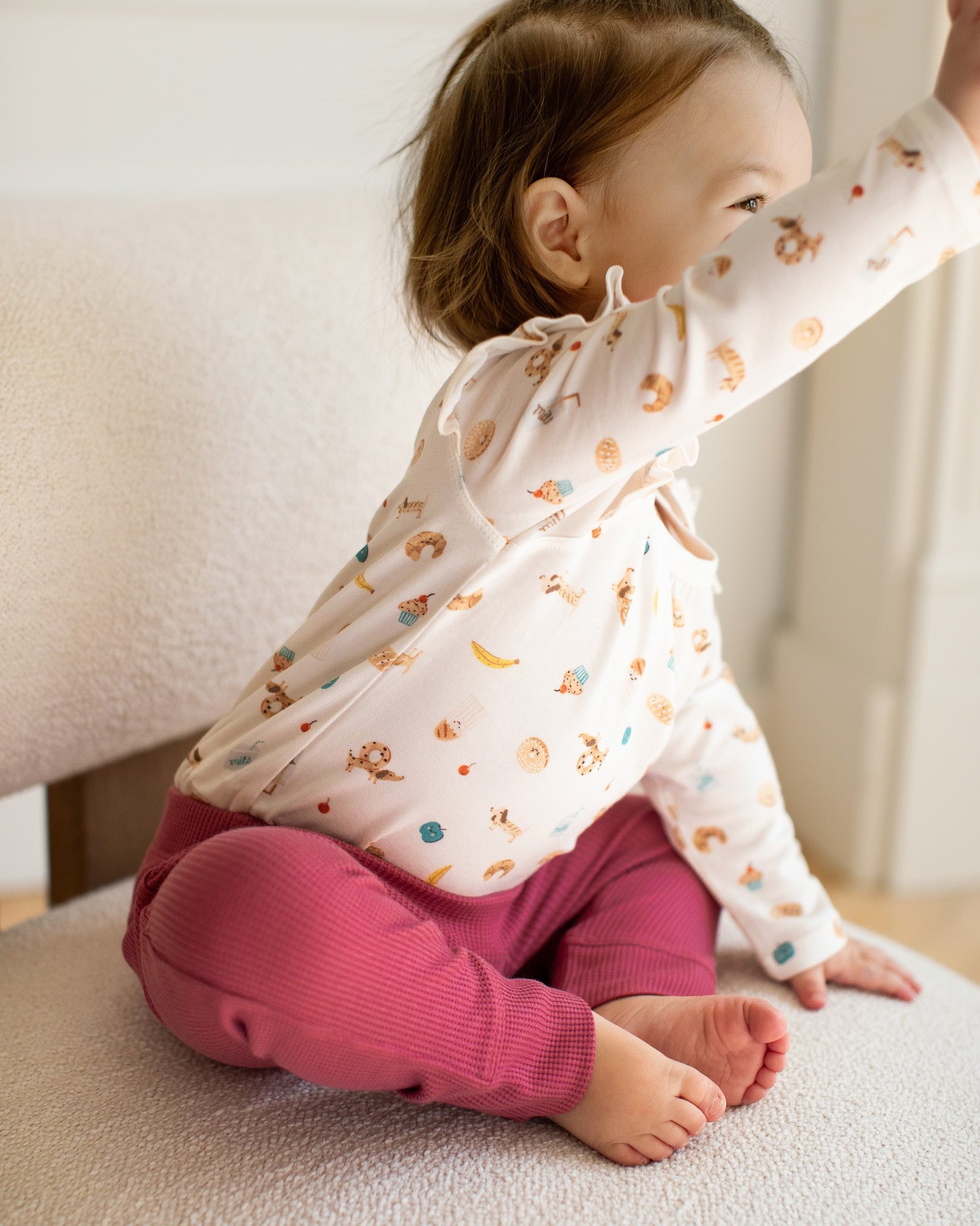 Loulou Lollipop Long Sleeve Ruffle Bodysuit in French Breakfast — front view on white background