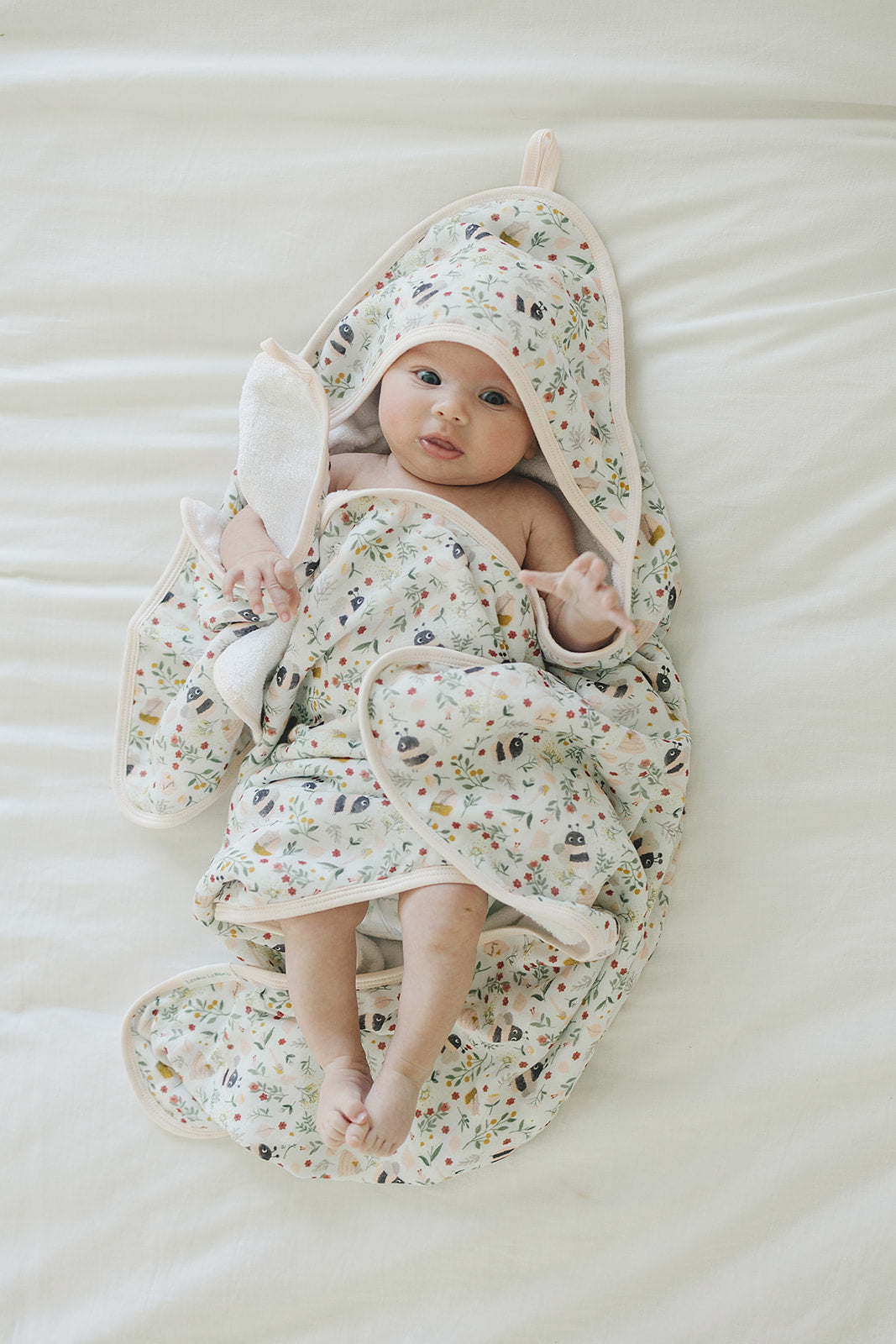 Loulou Lollipop hooded baby towel set in Bumble Bees — front view on white background