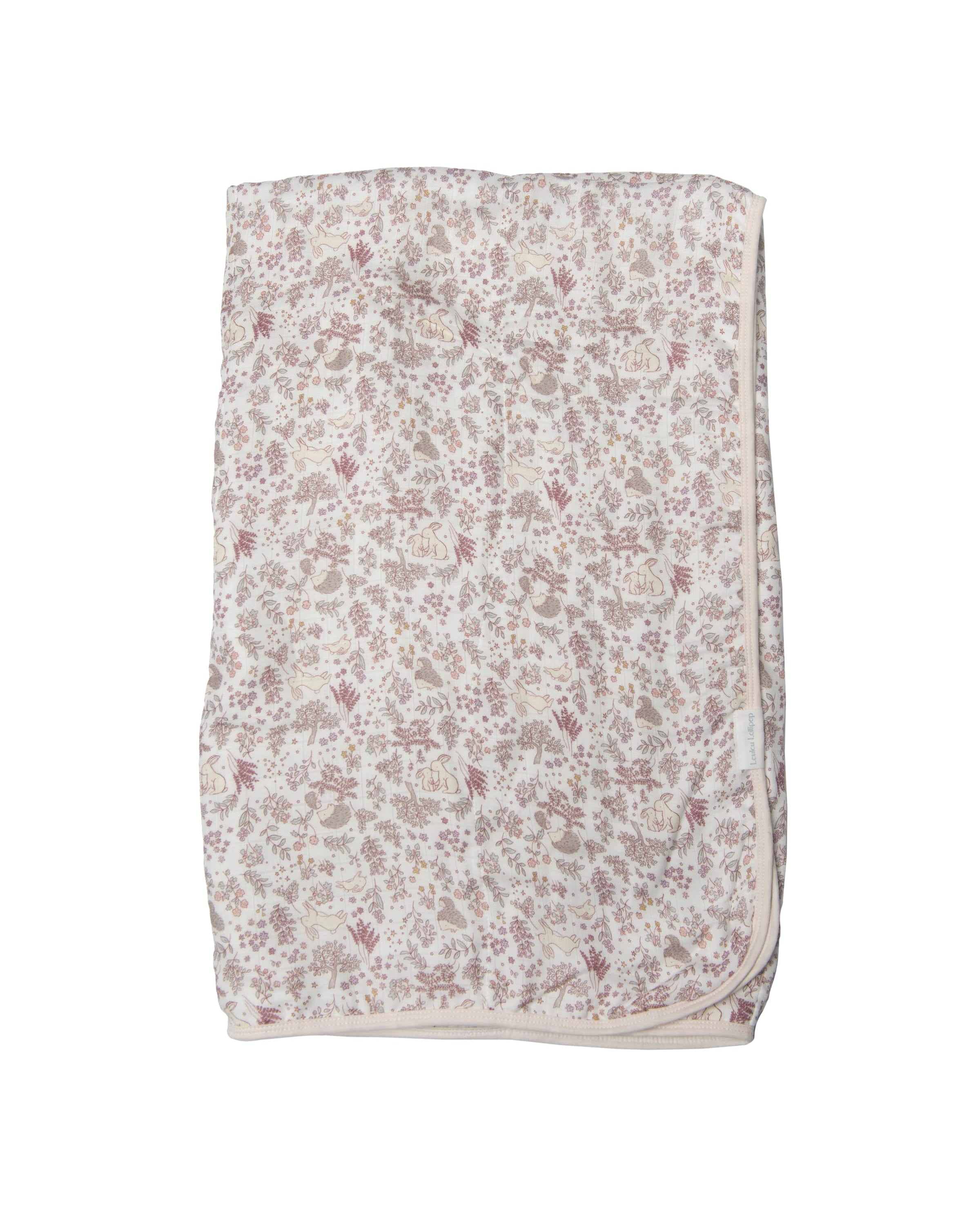 Loulou Lollipop muslin baby quilt blanket in Hedgehog Forest — front view on white background