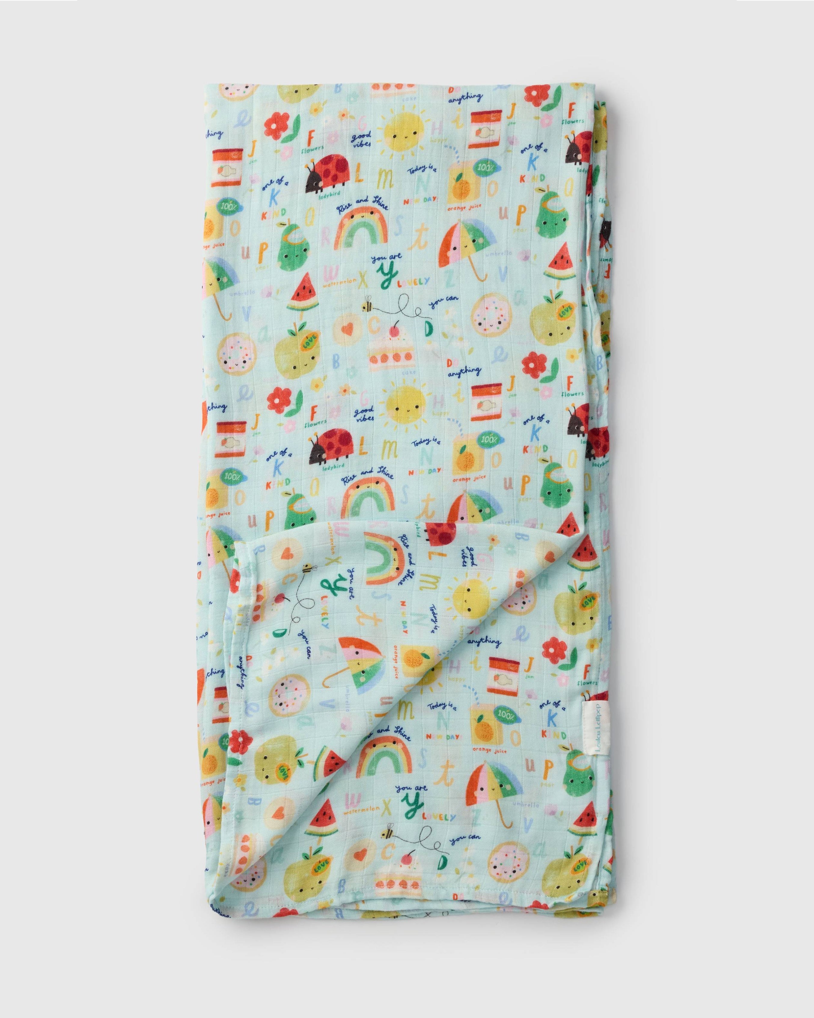 Loulou Lollipop bamboo cotton muslin swaddle blanket in Alphabet Smiles — front view on white background