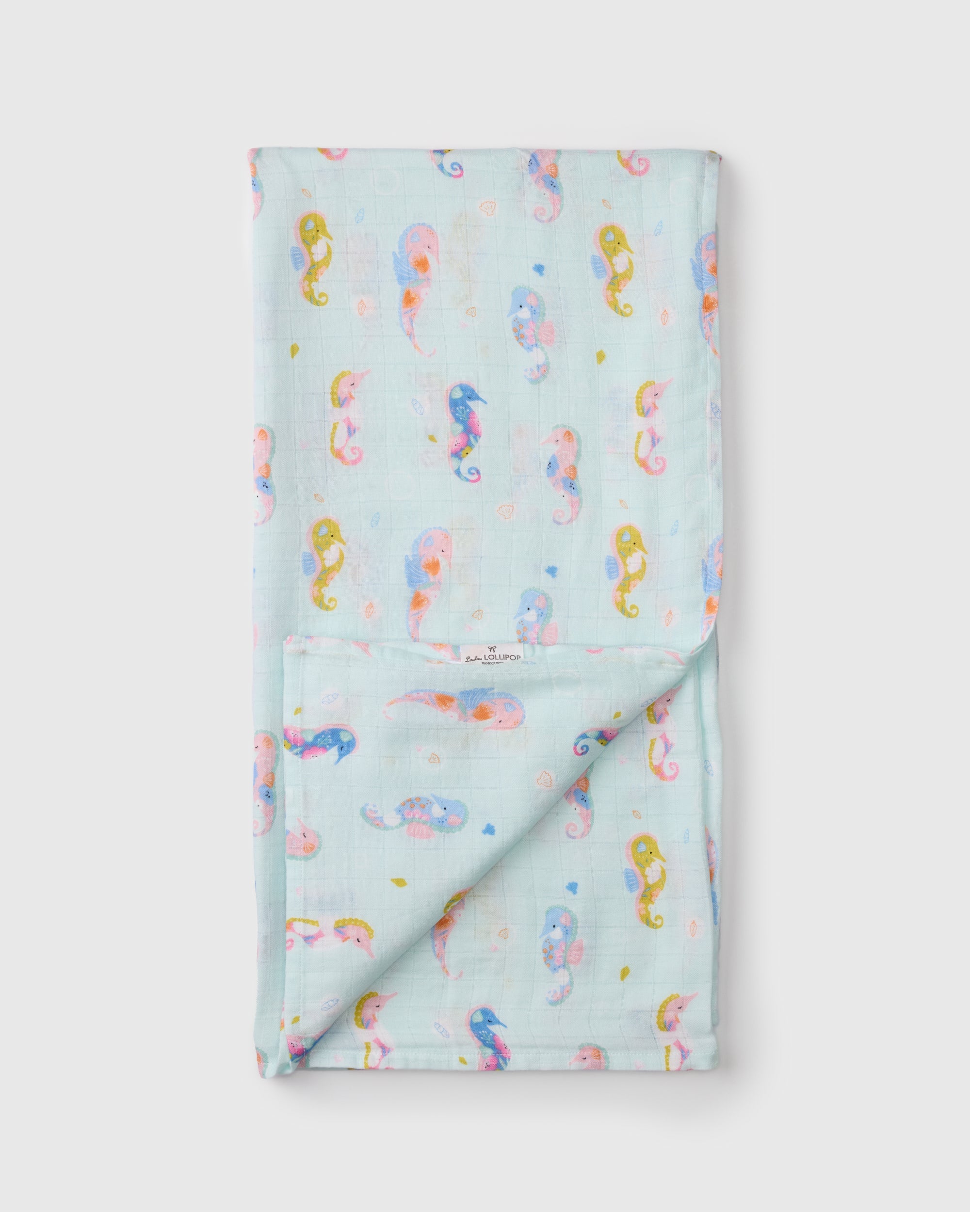 Loulou Lollipop bamboo cotton muslin swaddle blanket in Painterly Seahorses — front view on white background