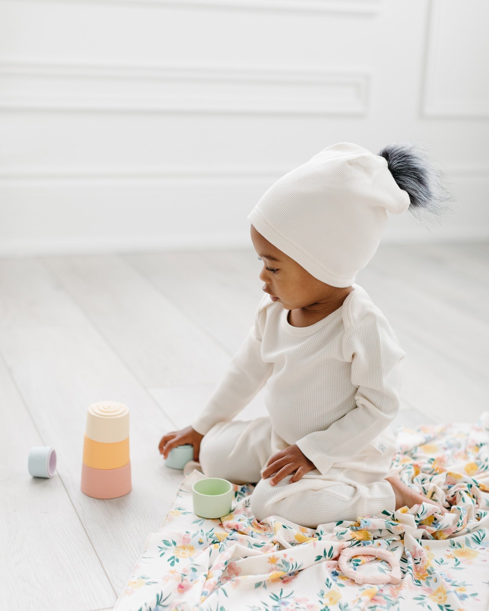 Loulou Lollipop Waffle Pom Pom Hat in Coconut Milk — front view on white background