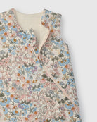 Floral patterned sleep bag on a white background