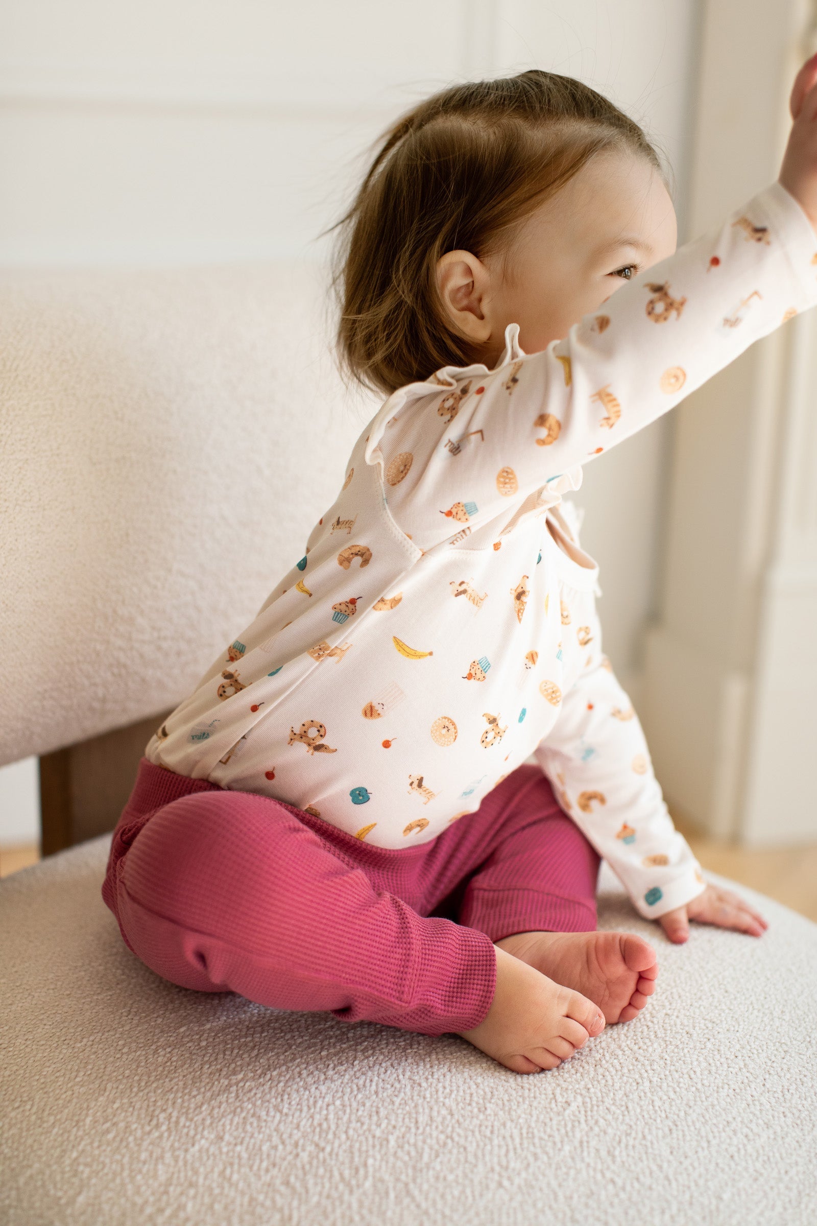 Loulou Lollipop Long Sleeve Ruffle Bodysuit in French Breakfast — front view on white background