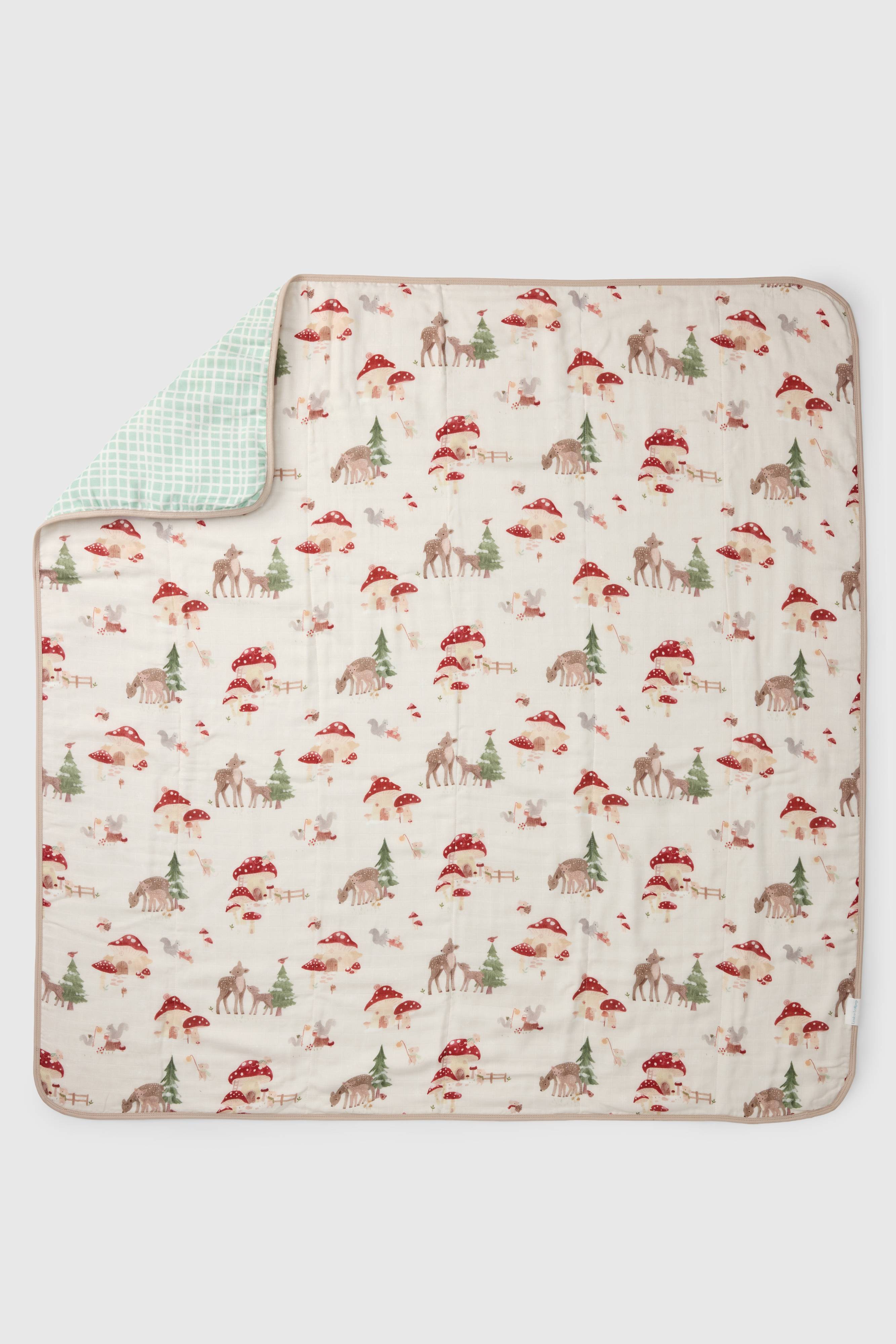 Loulou Lollipop muslin baby quilt blanket in Forest Families — front view on white background