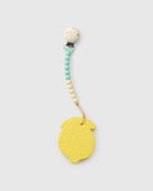 Yellow teething ring with a beaded holder on a white background
