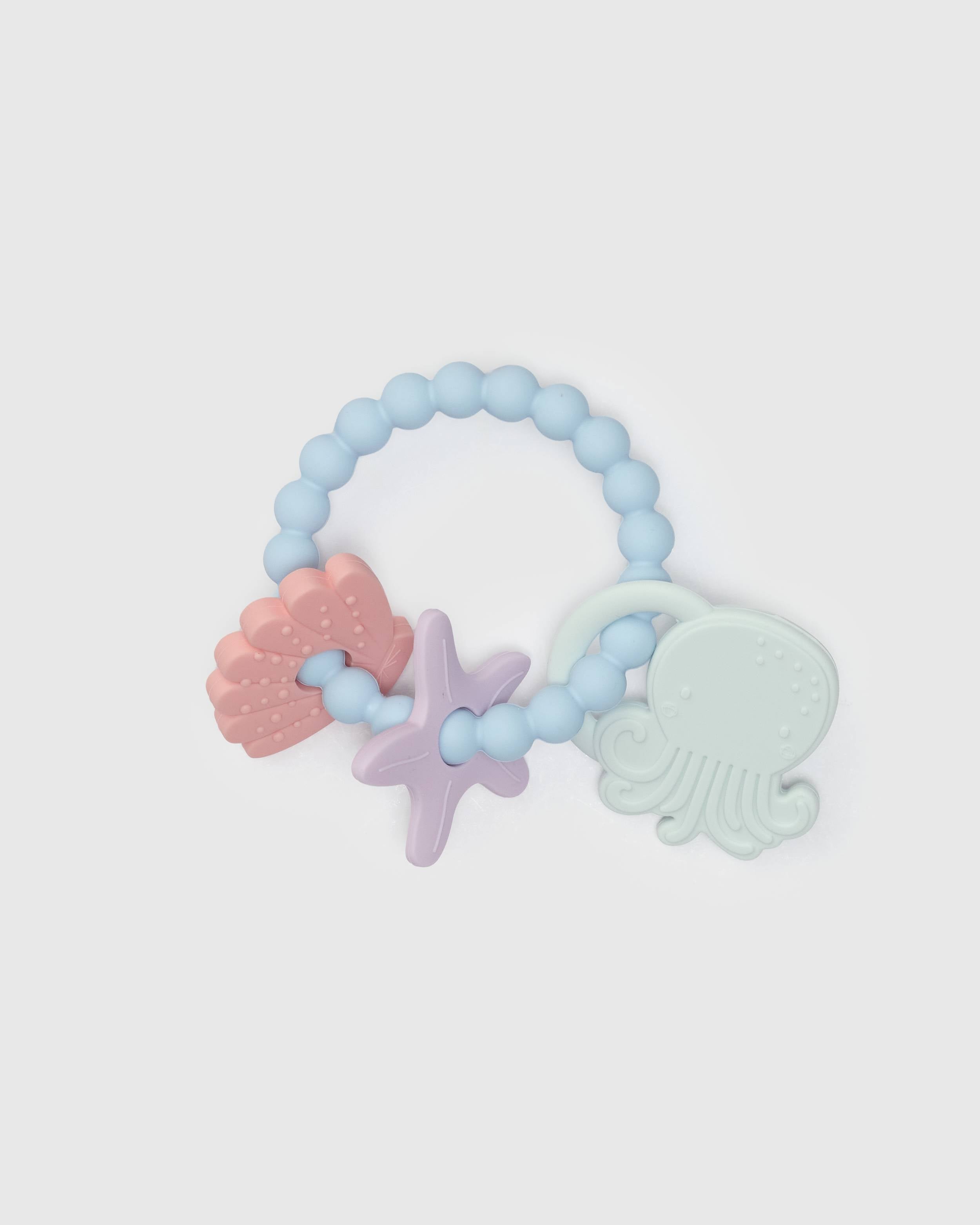 Loulou Lollipop Teething Charms in Skylar Shell — front view on white background
